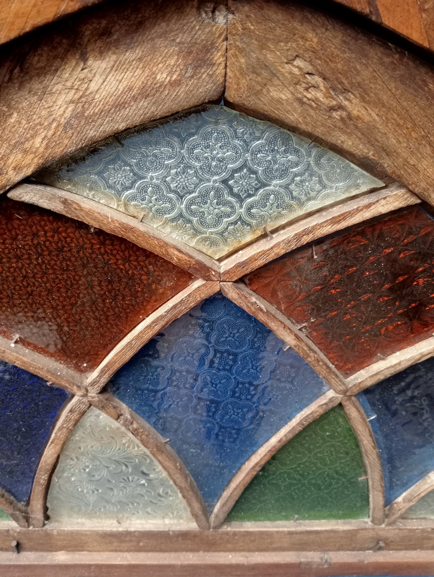 18th C. Arched Cottage fanlight with coloured glass and curved lattice bars
