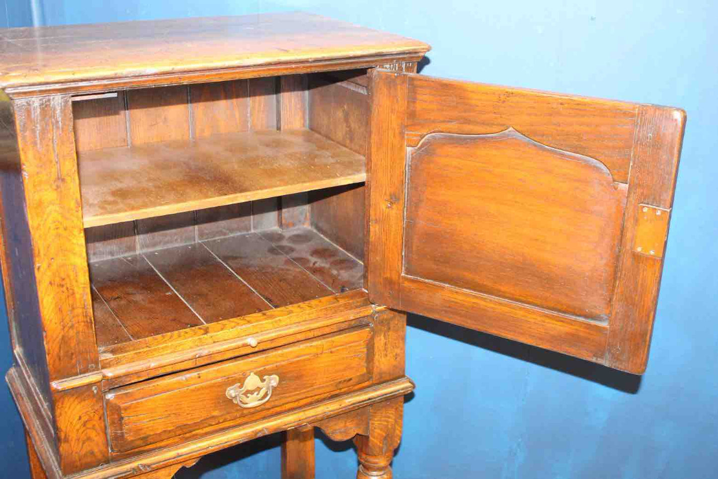 18th C. side cabinet with fielded panel door with draw under