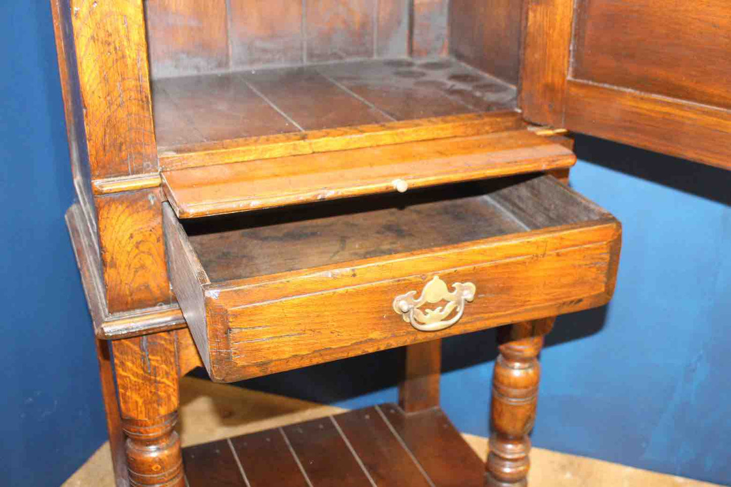 18th C. side cabinet with fielded panel door with draw under