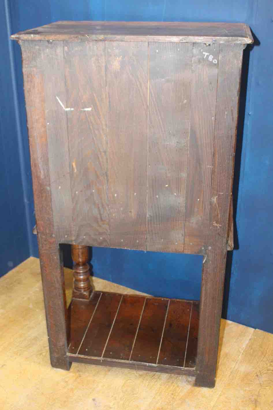 18th C. side cabinet with fielded panel door with draw under