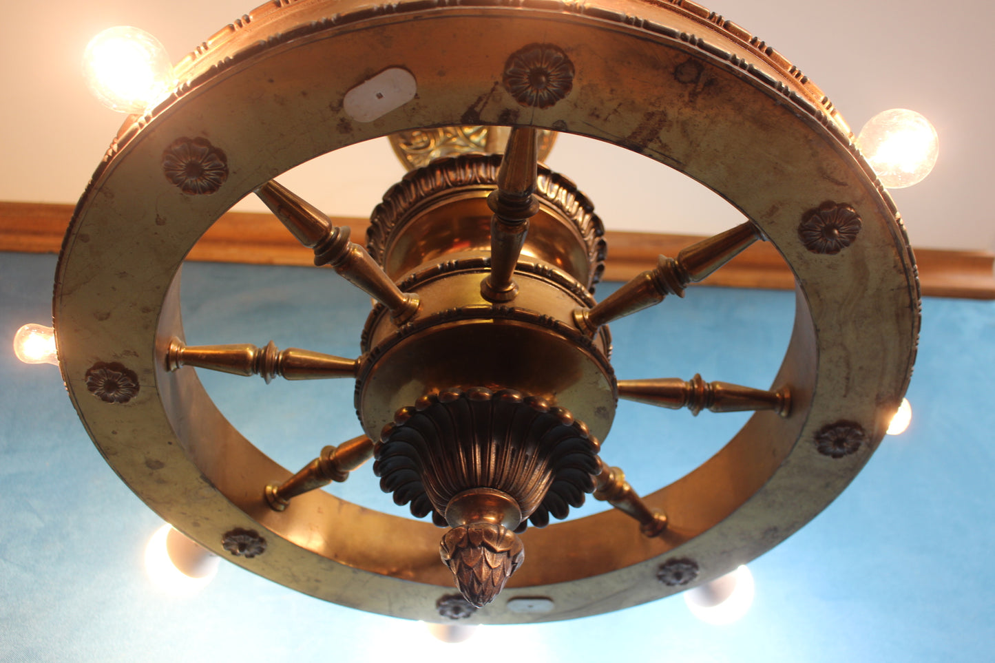 Brass hanging ceiling light in the form of a wagon wheel