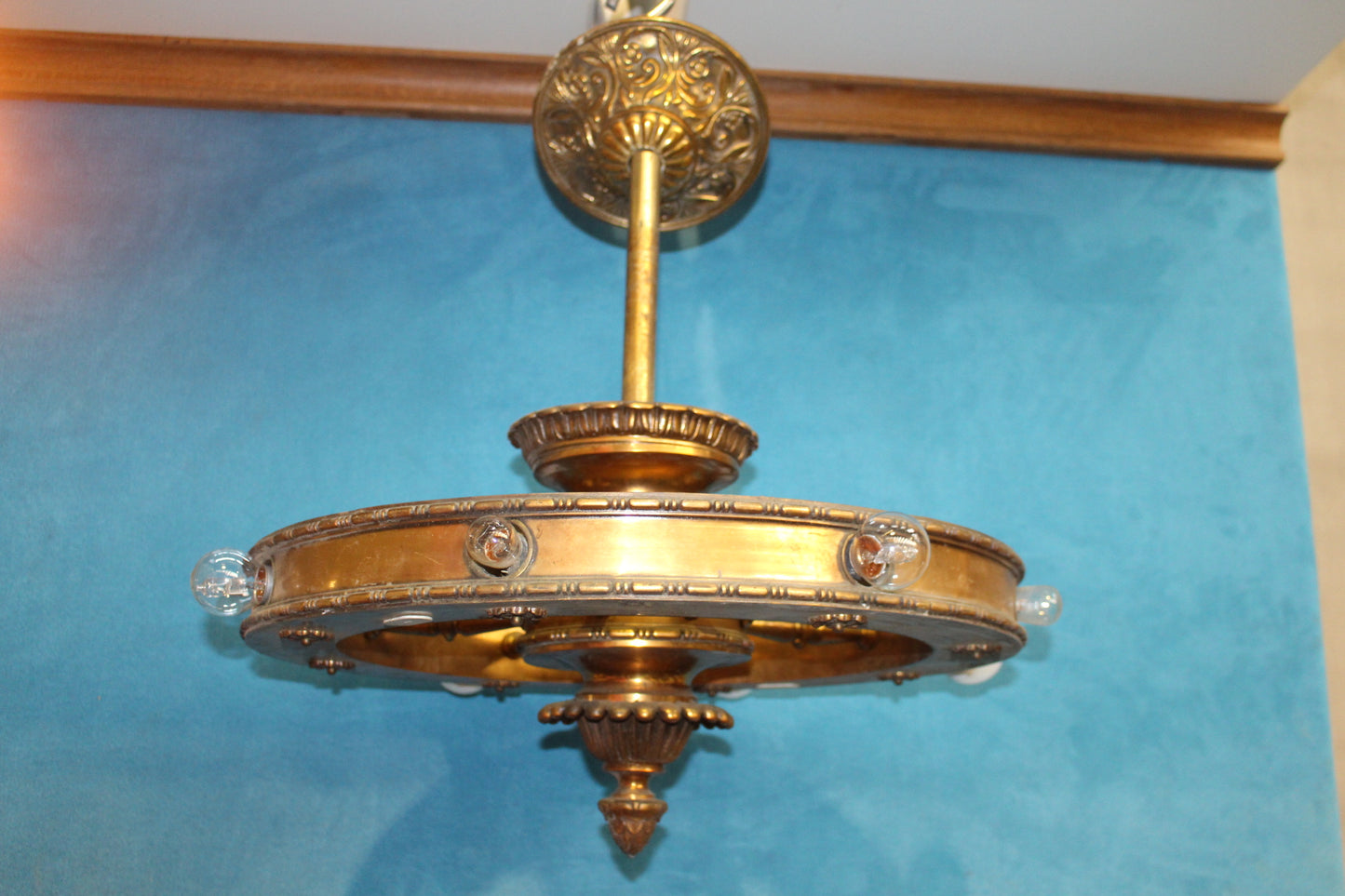 Brass hanging ceiling light in the form of a wagon wheel