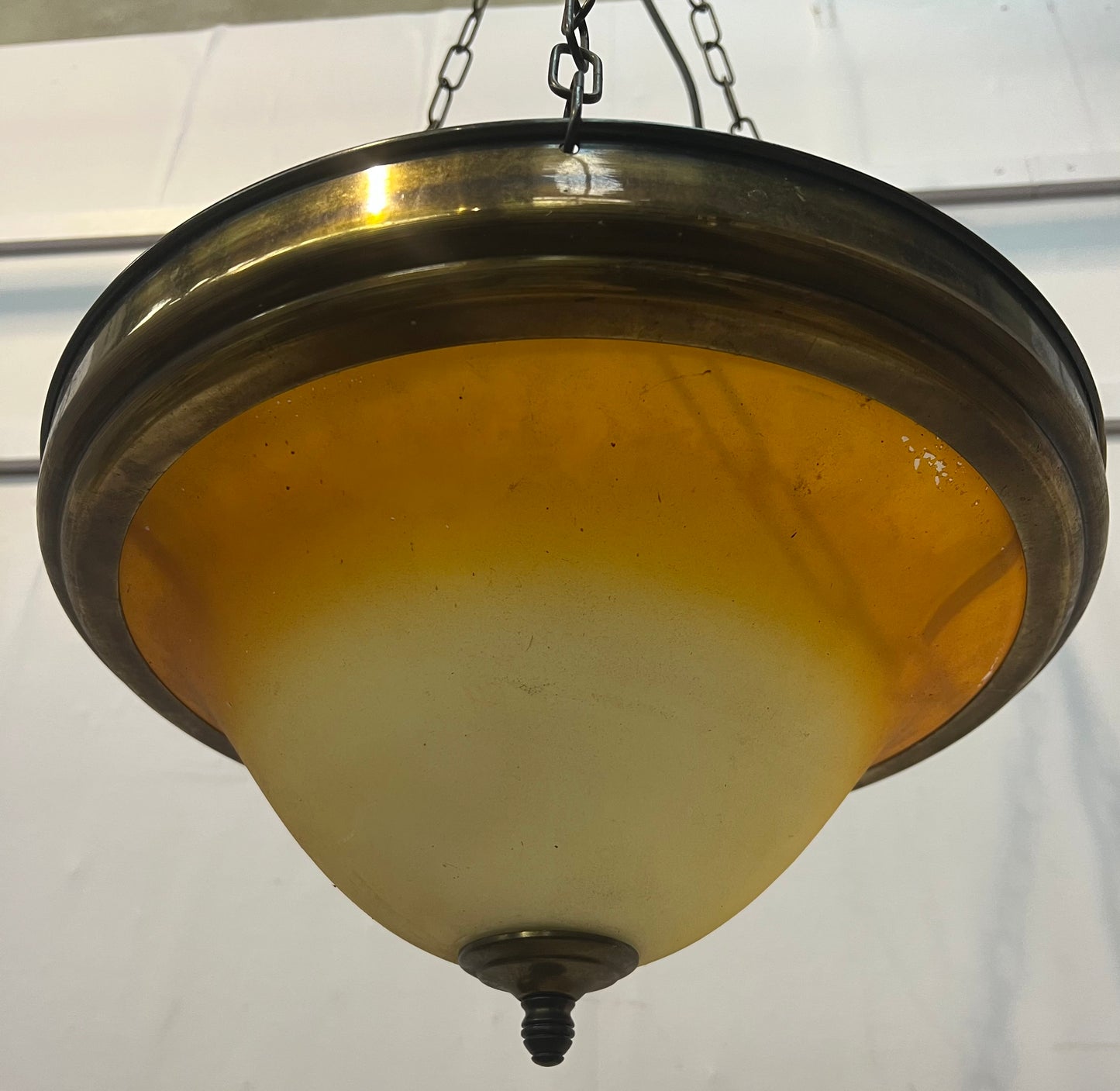 Brass rim hanging uplighter with amber shade
