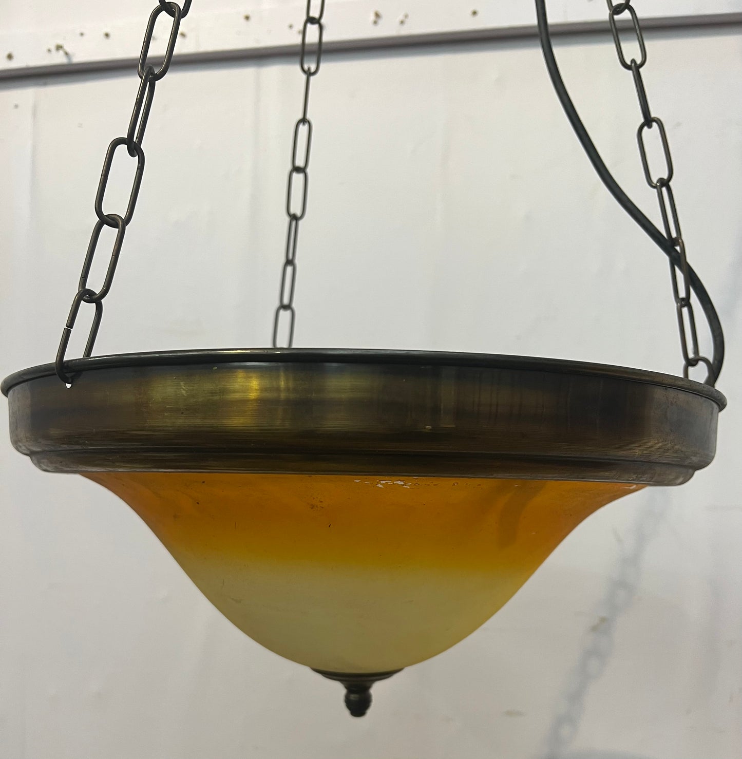 Brass rim hanging uplighter with amber shade