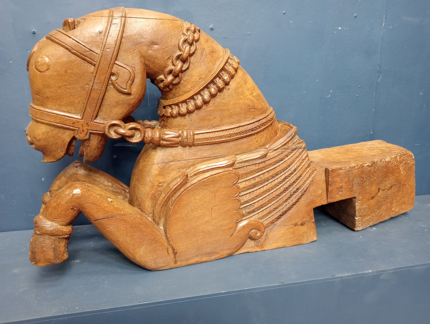 Carved wooden figural corbel in the form of a horse