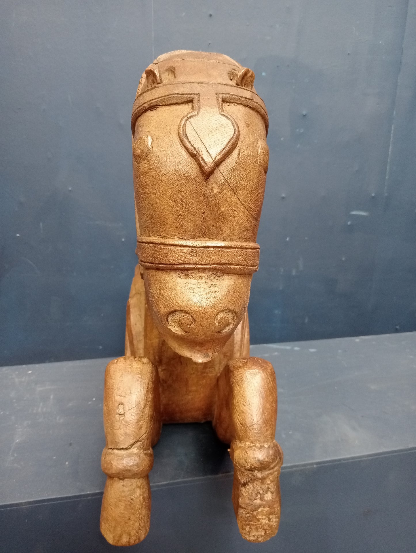 Carved wooden figural corbel in the form of a horse