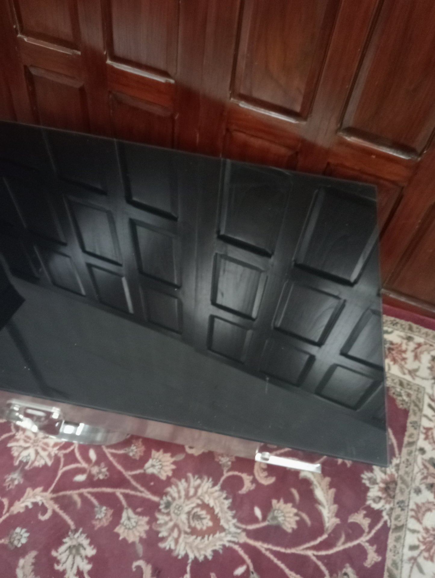 Chrome Coffee table on wheels with black glass top