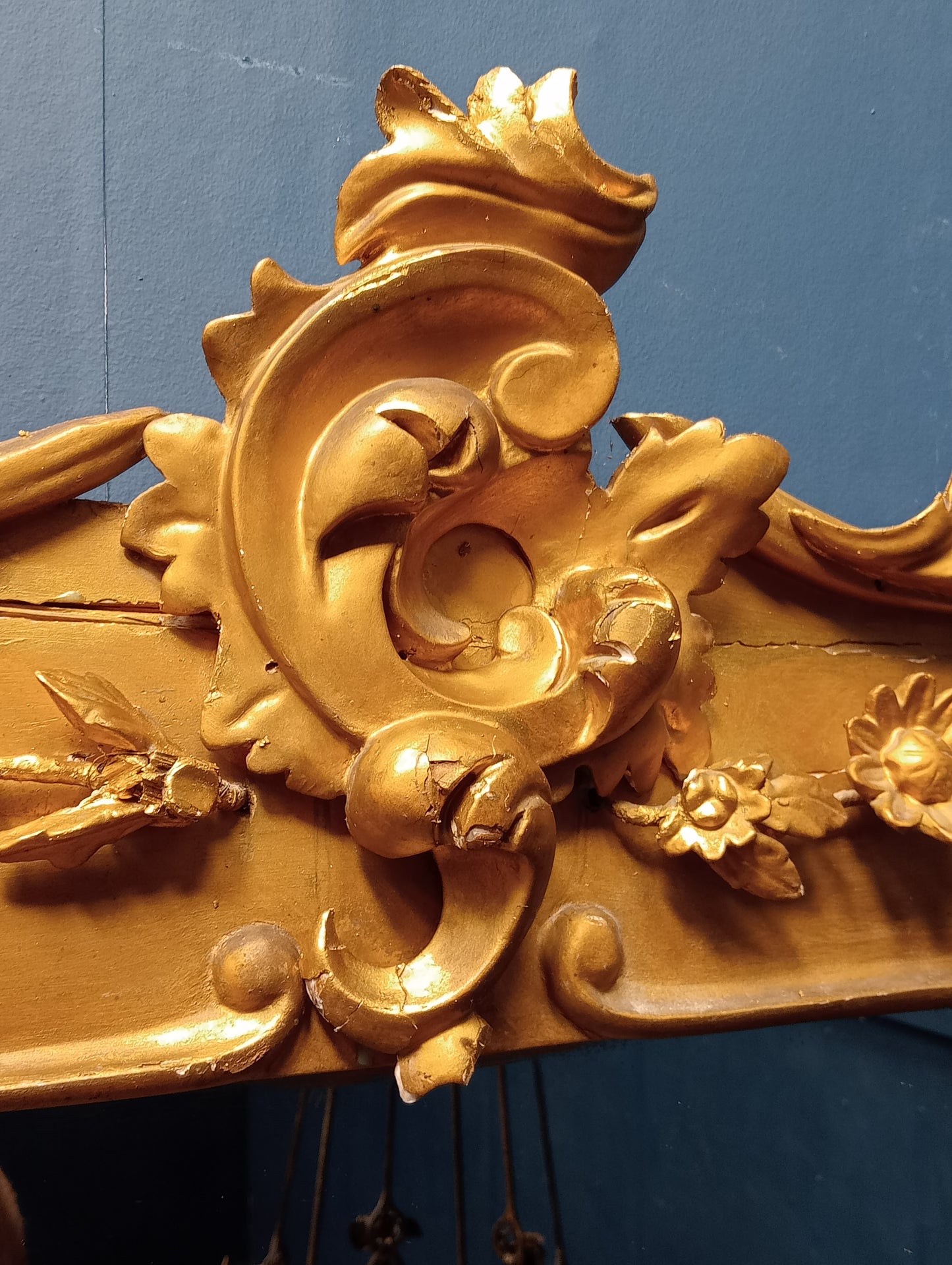 Gilt overmantle mirror with foliate surmount