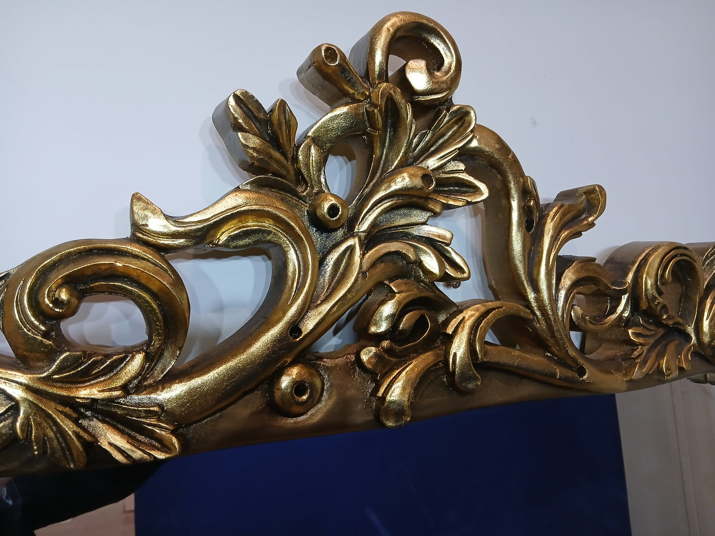 Large giltwood baroque style mirror with deer motif overmantle