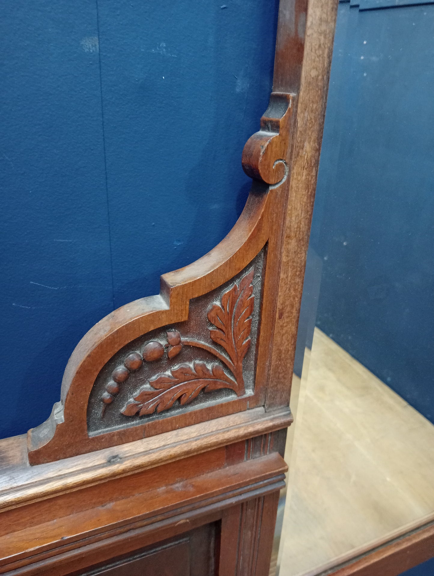 Mahogany overmantel with bevel glass and leaf design