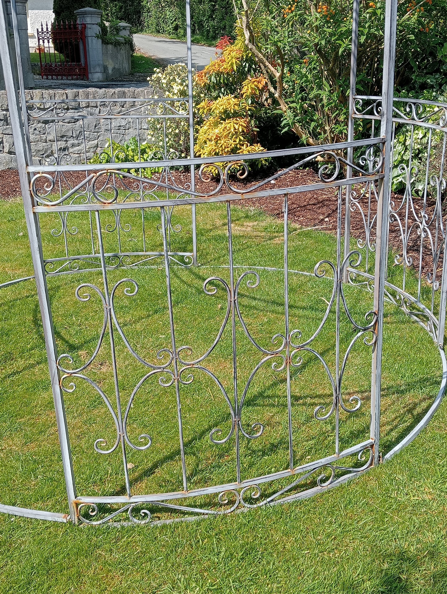 Metal garden gazebo with scroll design