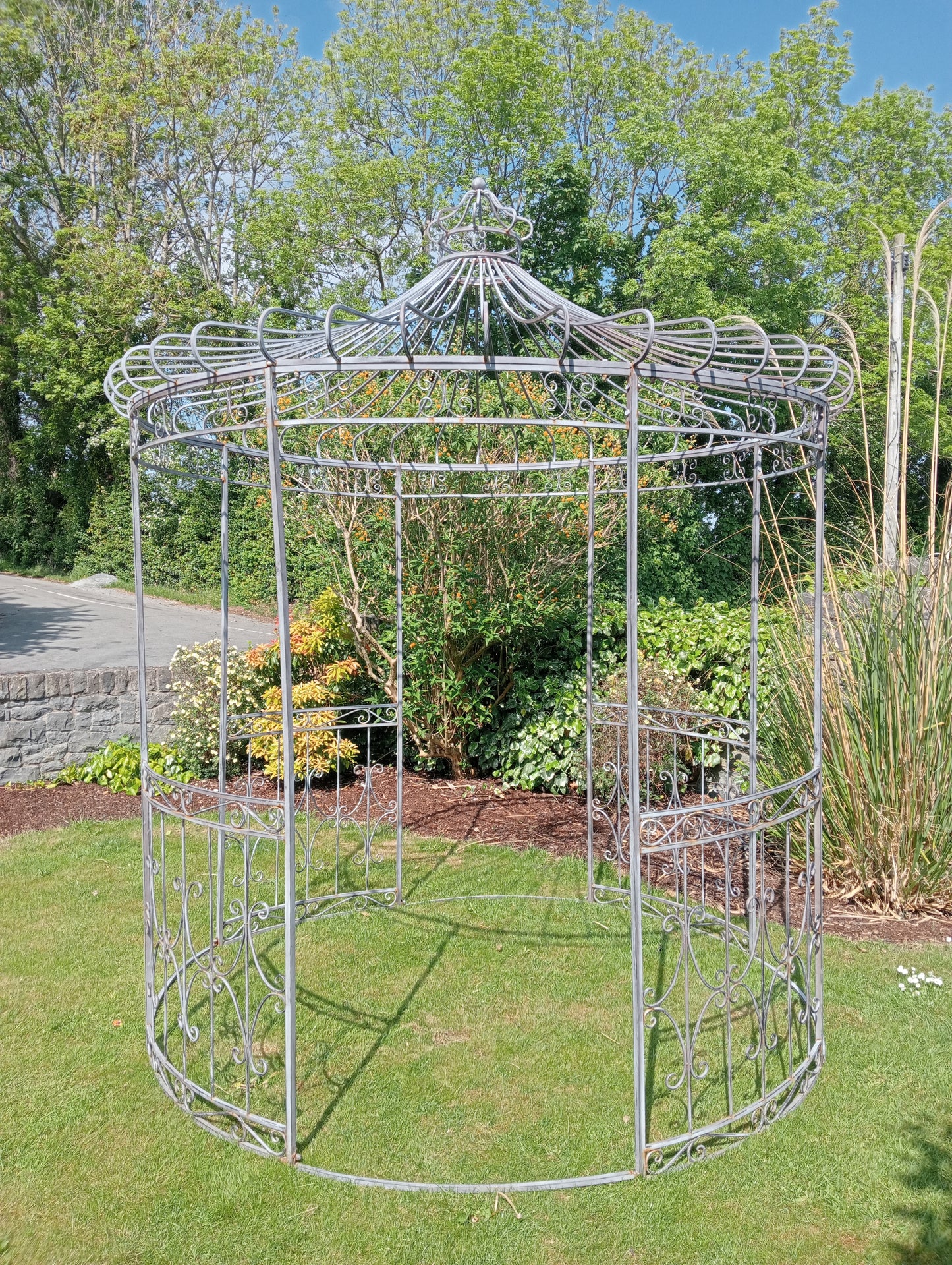 Metal garden gazebo with scroll design