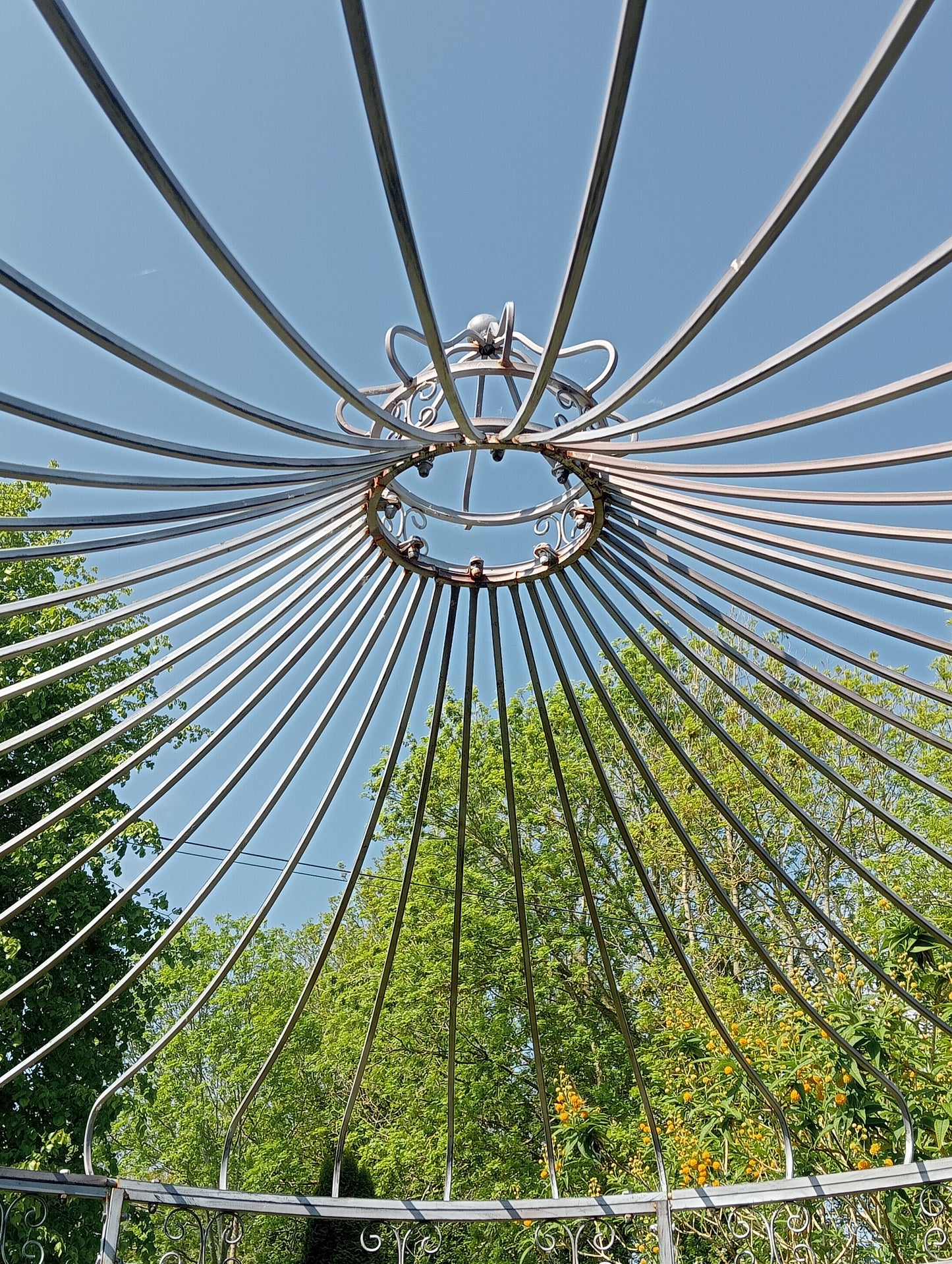 Metal garden gazebo with scroll design