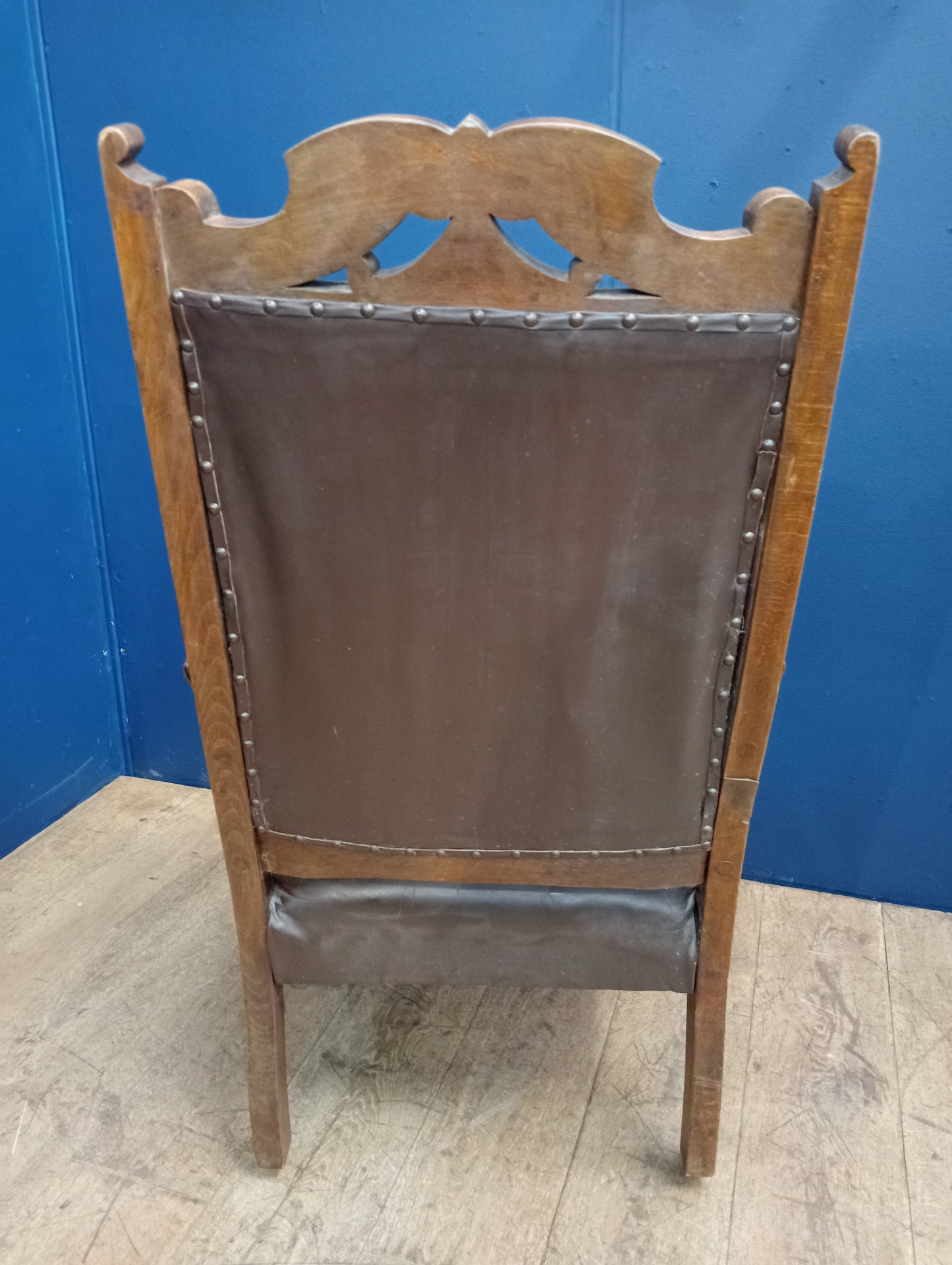 Oak deep button leather armchair on casters