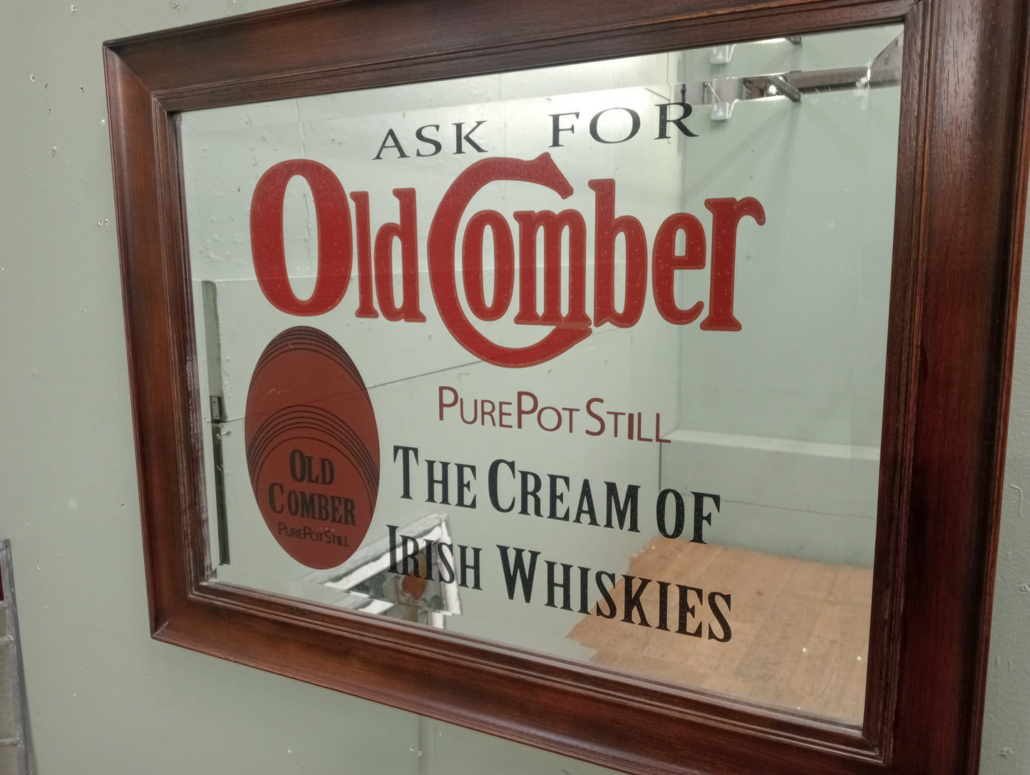 Ask for old Comber pure pot still the cream of Irish whiskies bevelled advertising mirror