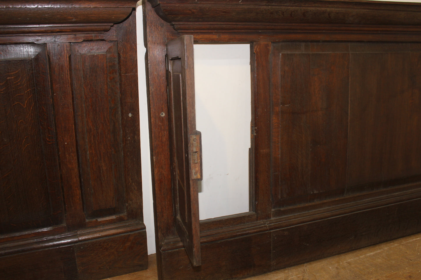 One lot of 3 metre oak wall panelling with one secretive opening door
