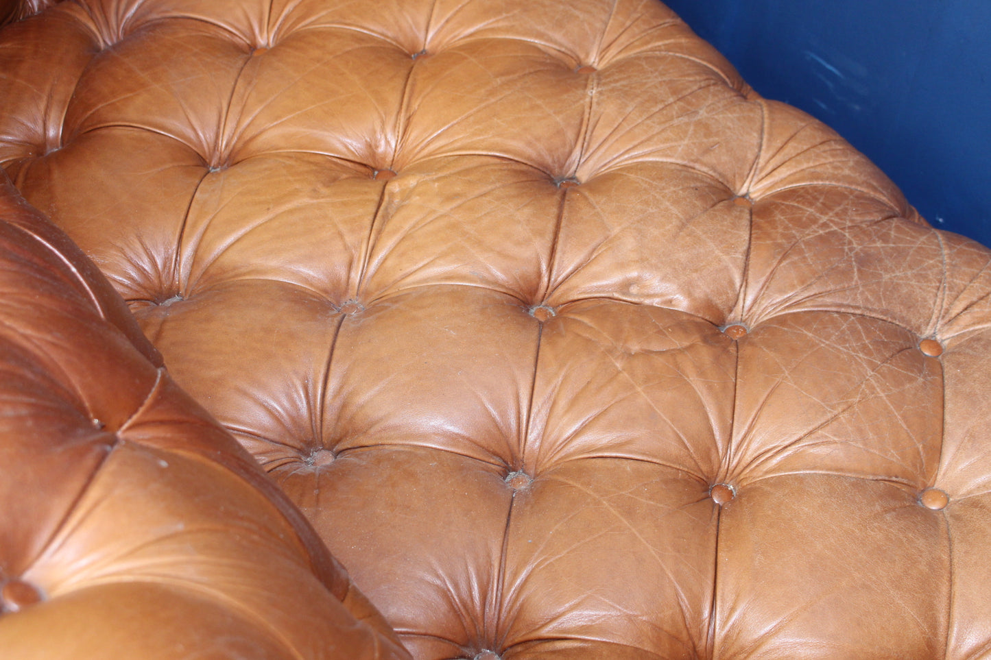 Overstuffed deep button leather chesterfield sofa