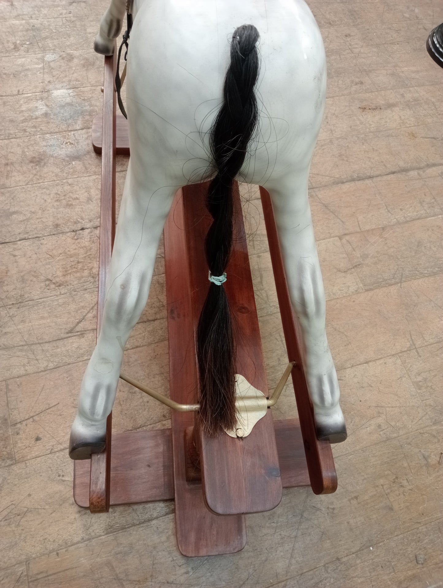 Painted dapple grey rocking horse with leather reins and saddle
