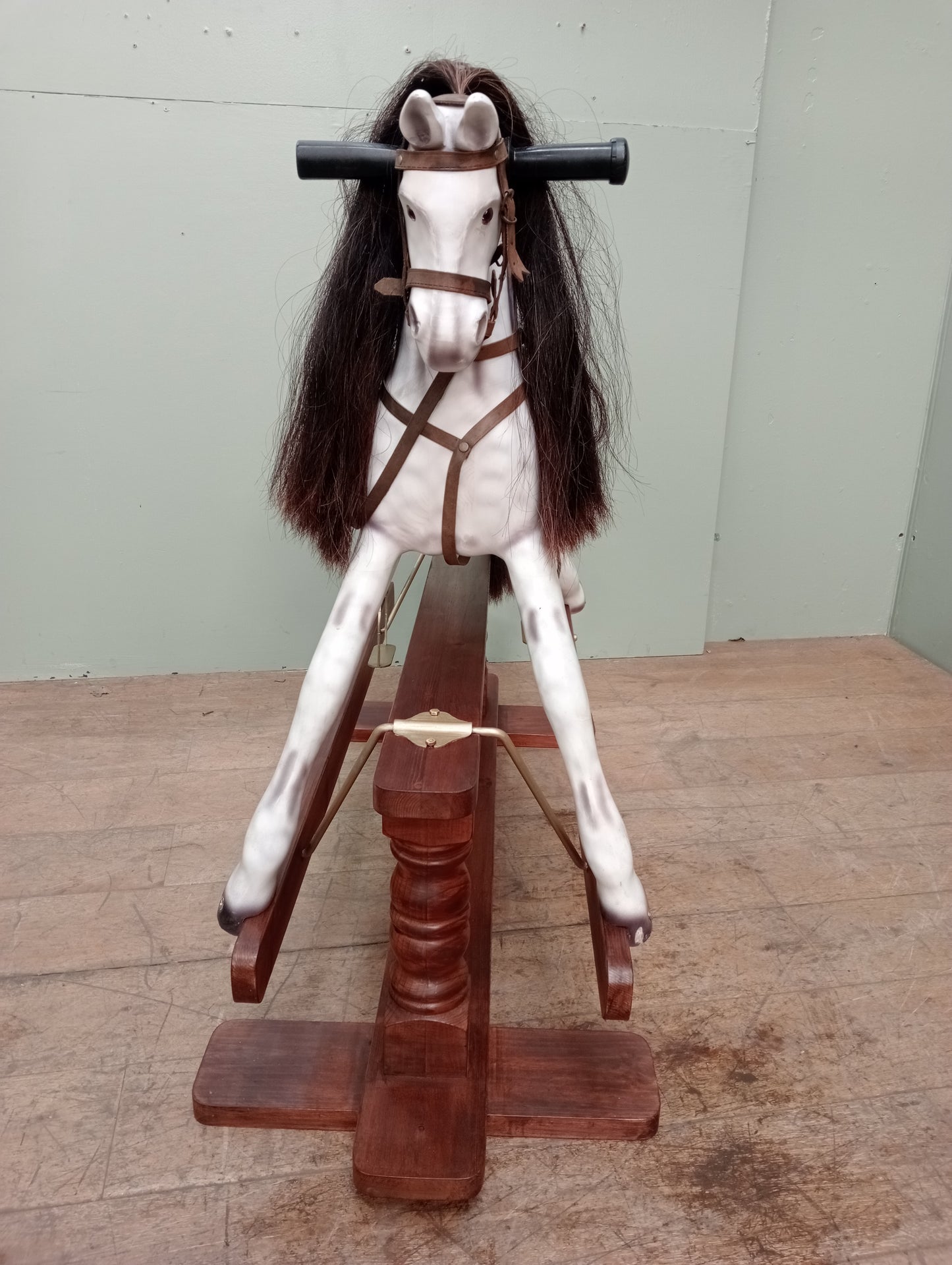 Painted dapple grey rocking horse with leather reins and saddle