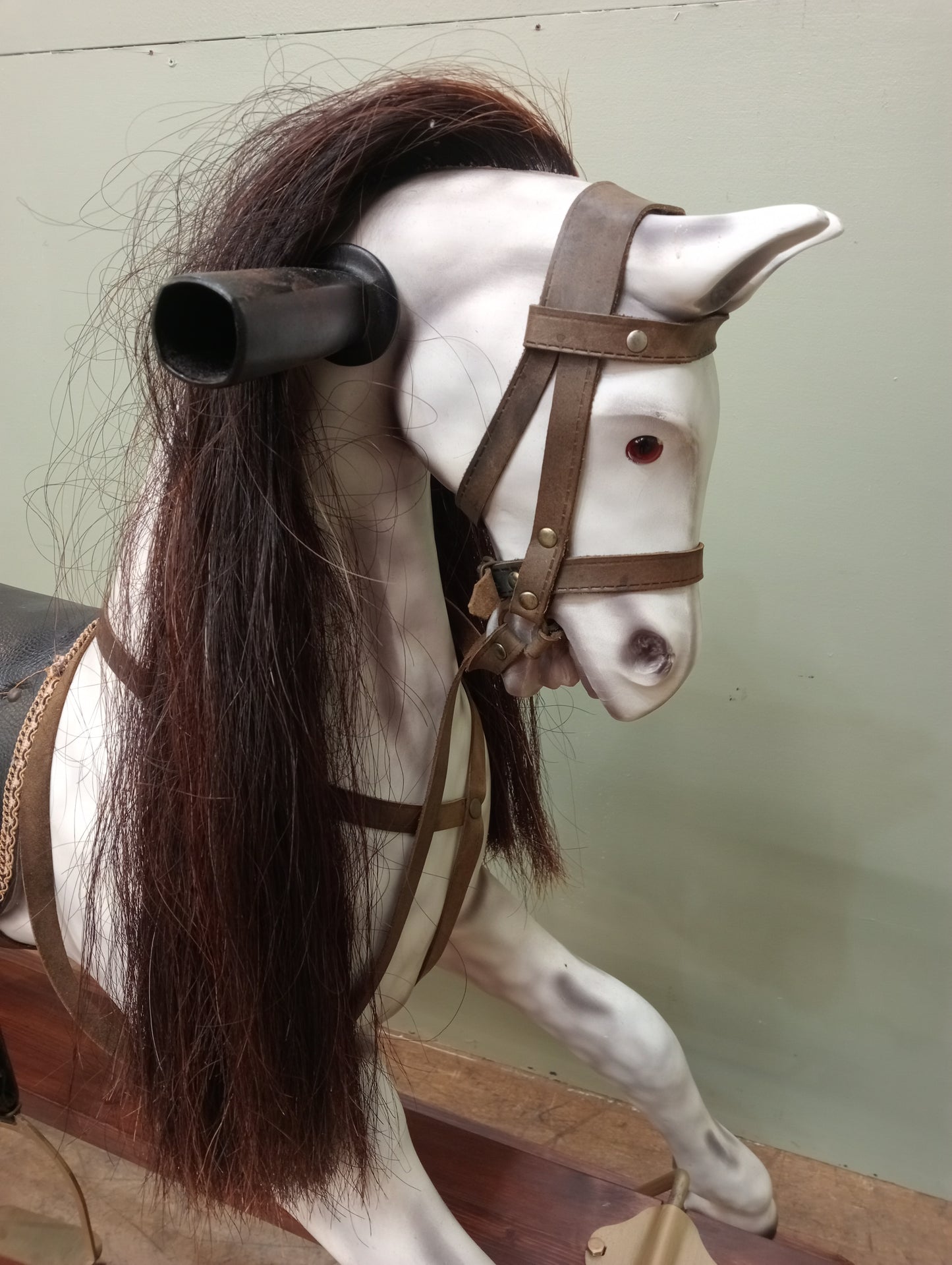 Painted dapple grey rocking horse with leather reins and saddle