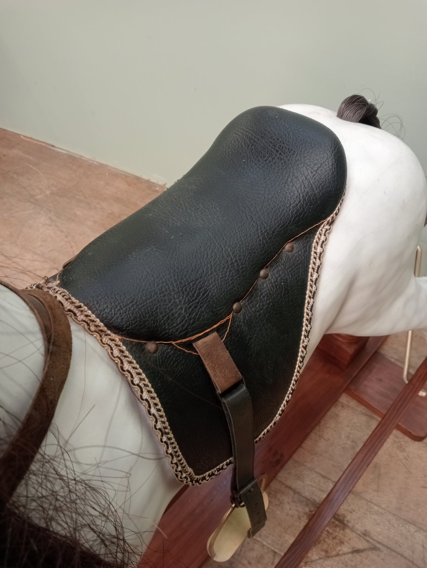 Painted dapple grey rocking horse with leather reins and saddle