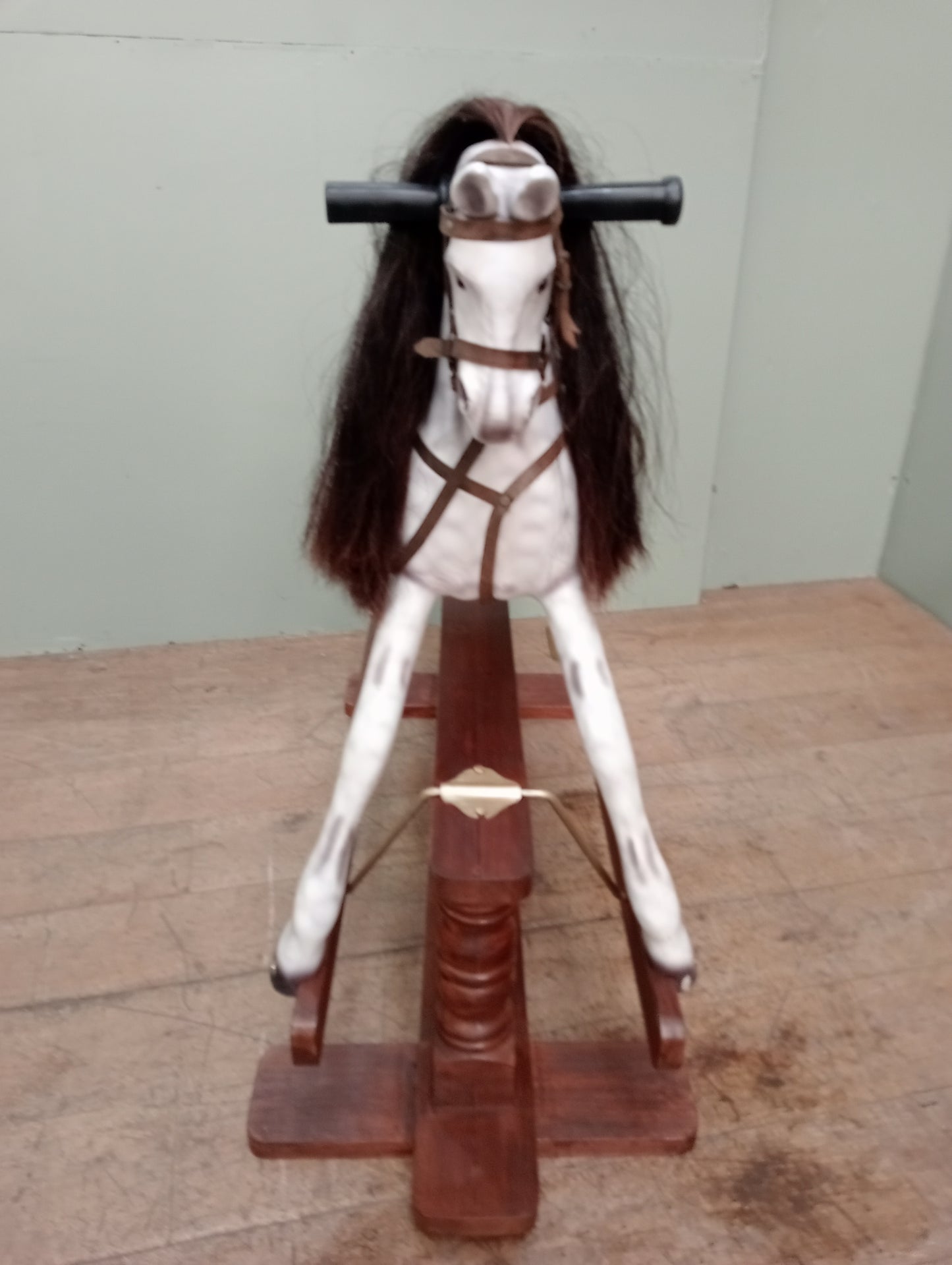 Painted dapple grey rocking horse with leather reins and saddle