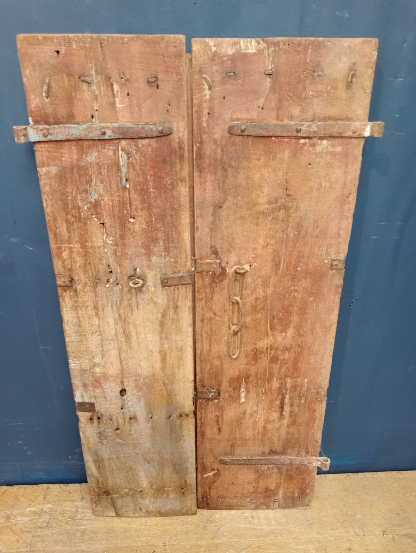 Carved wooden Moroccan door with metal panels and studding