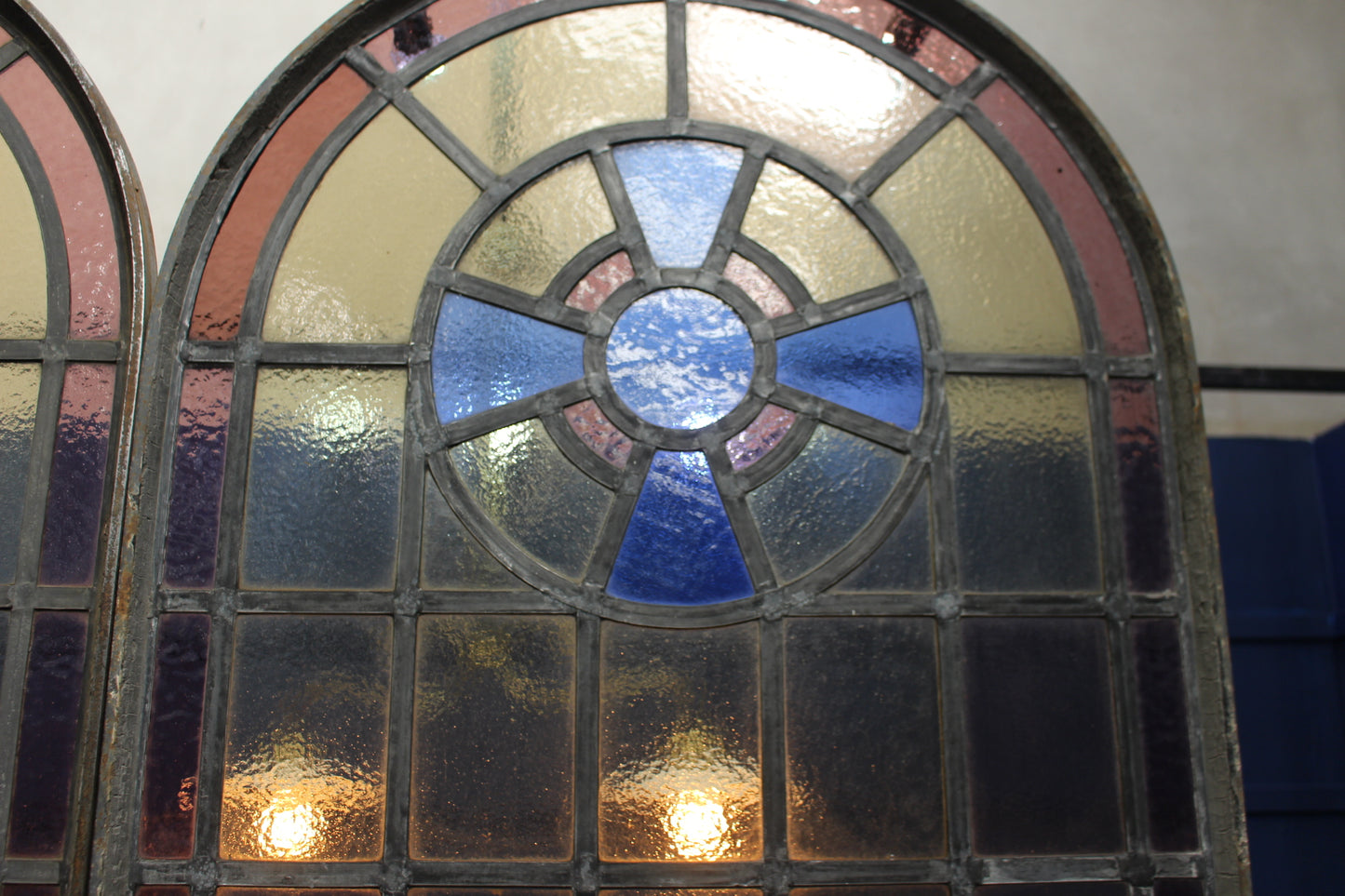 Pair of arched wrought iron leaded glass windows with opening to bottom in mint condition