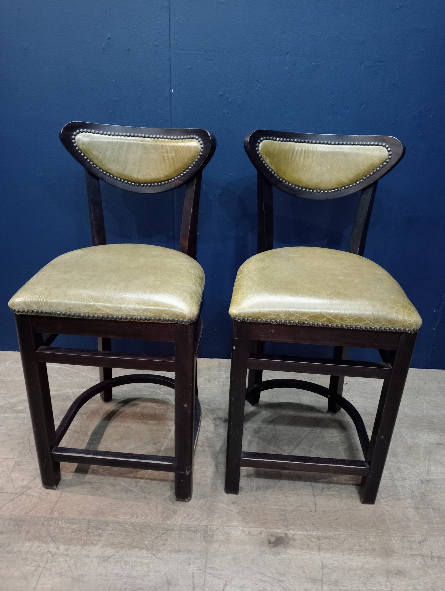 Pair of breakfast bar high stools green leather seat and back