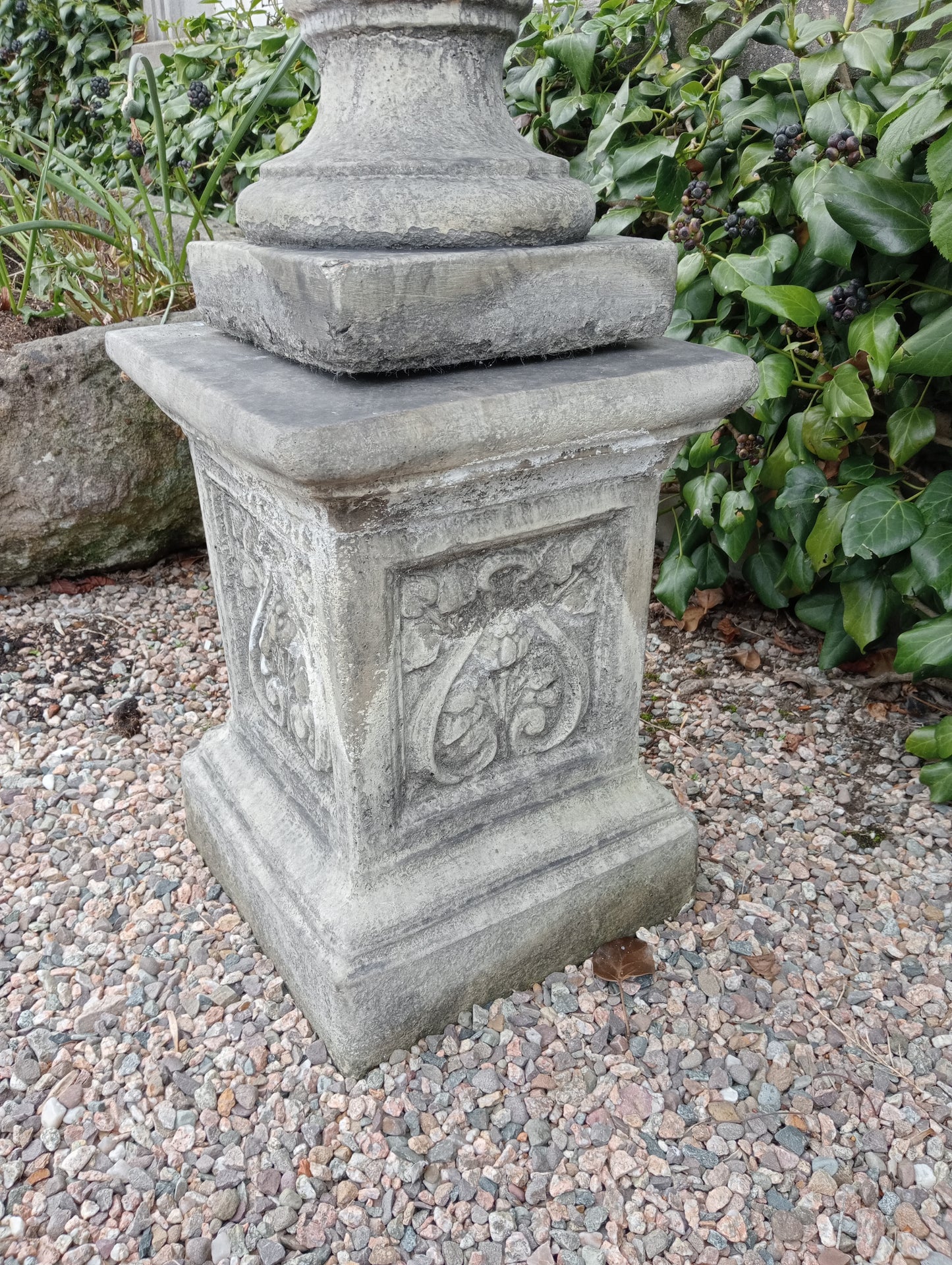 Pair of composition lidded urns and bases with swags and lion masks