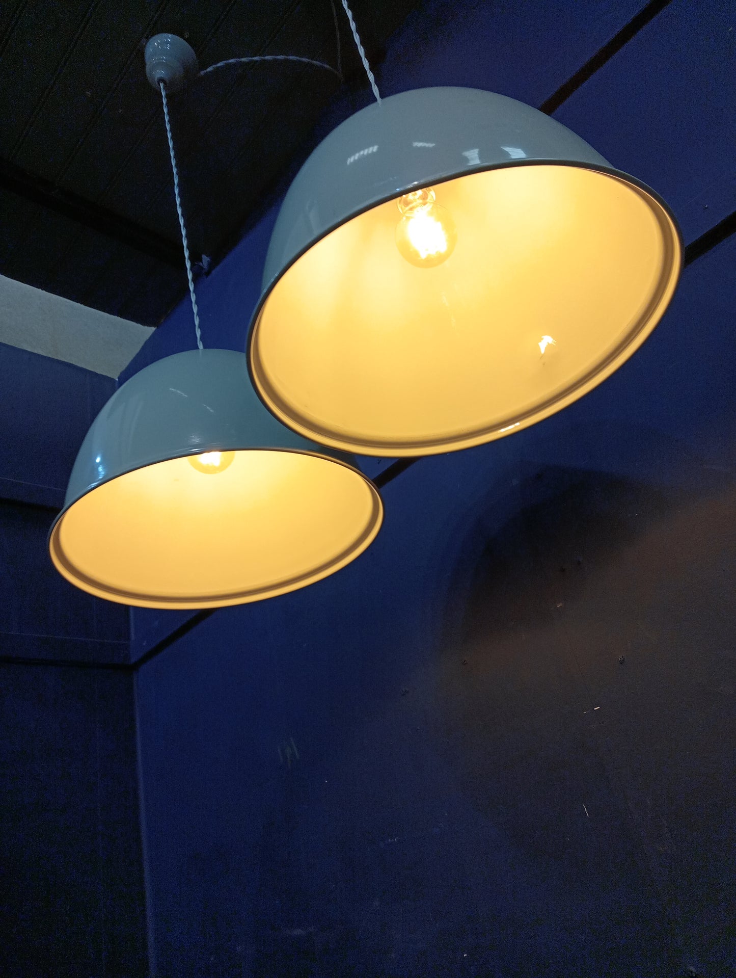 Pair of enamel cream industrial hanging lights