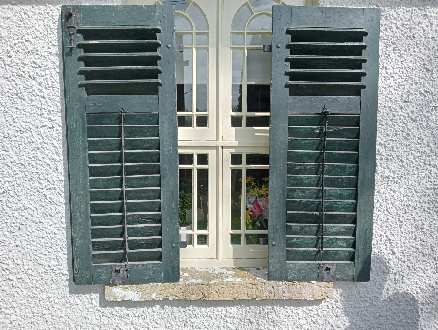 Pair of french style green louvred window shutters