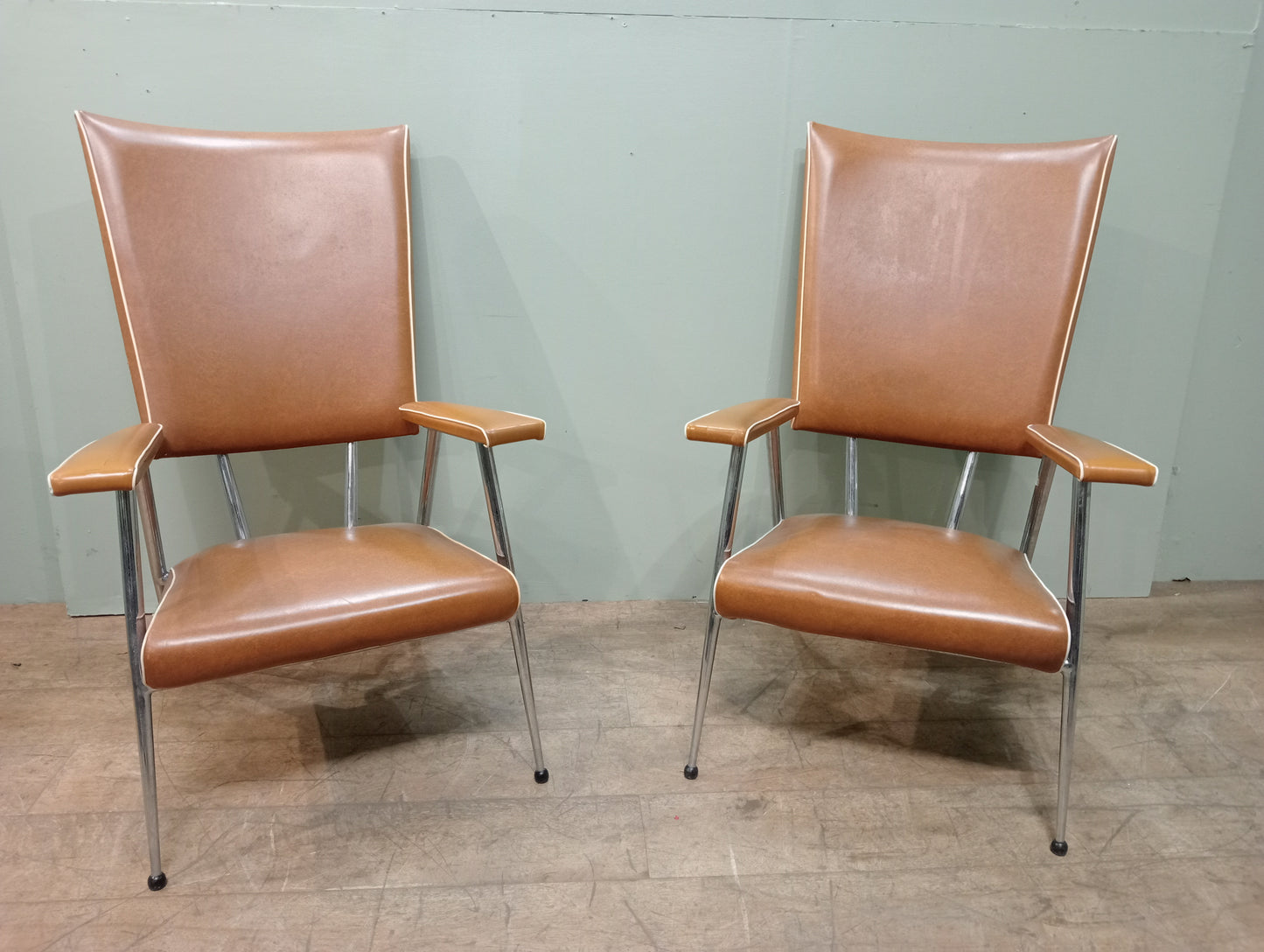 Pair of retro chrome leather armchairs