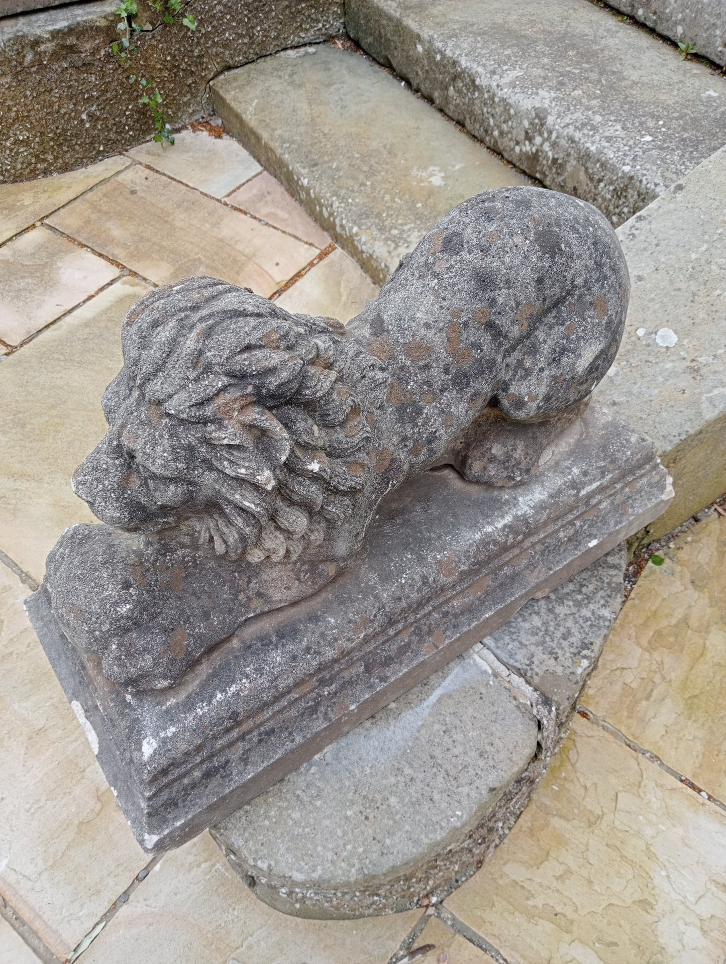 Pair of stone lions with ball