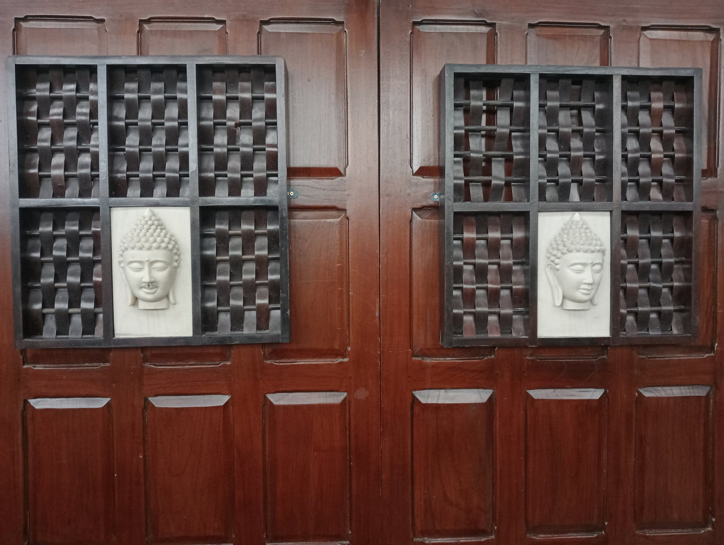Pair of tribal carving ladies and gents budda head