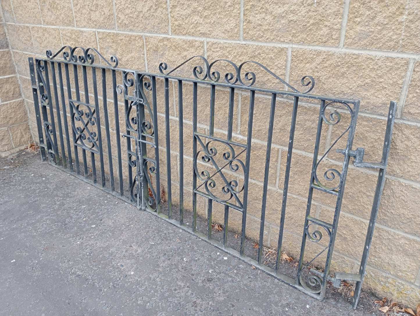Pair of wrought iron entrance gates centre scroll design