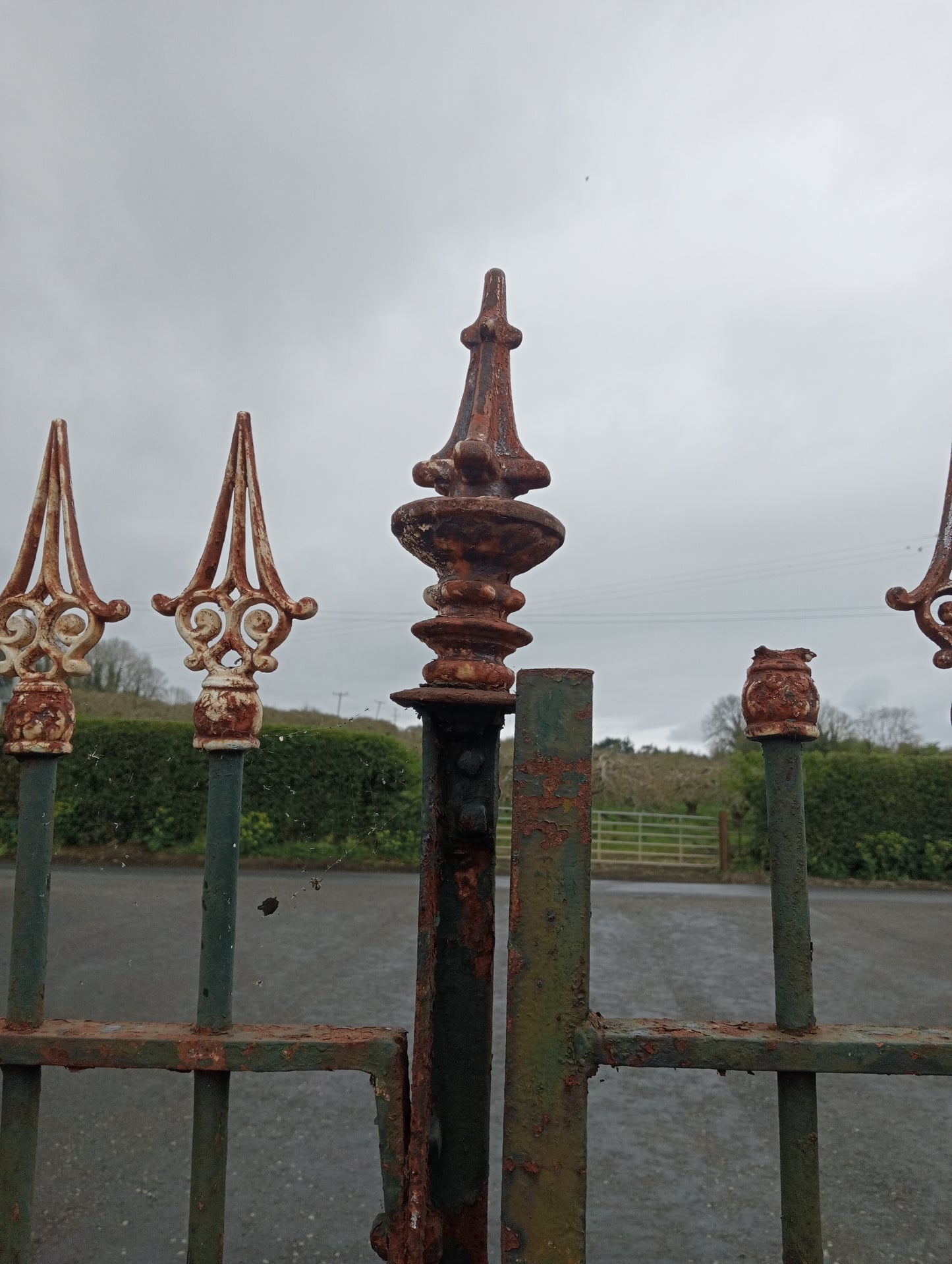 Pair of wrought iron gates spiked finials