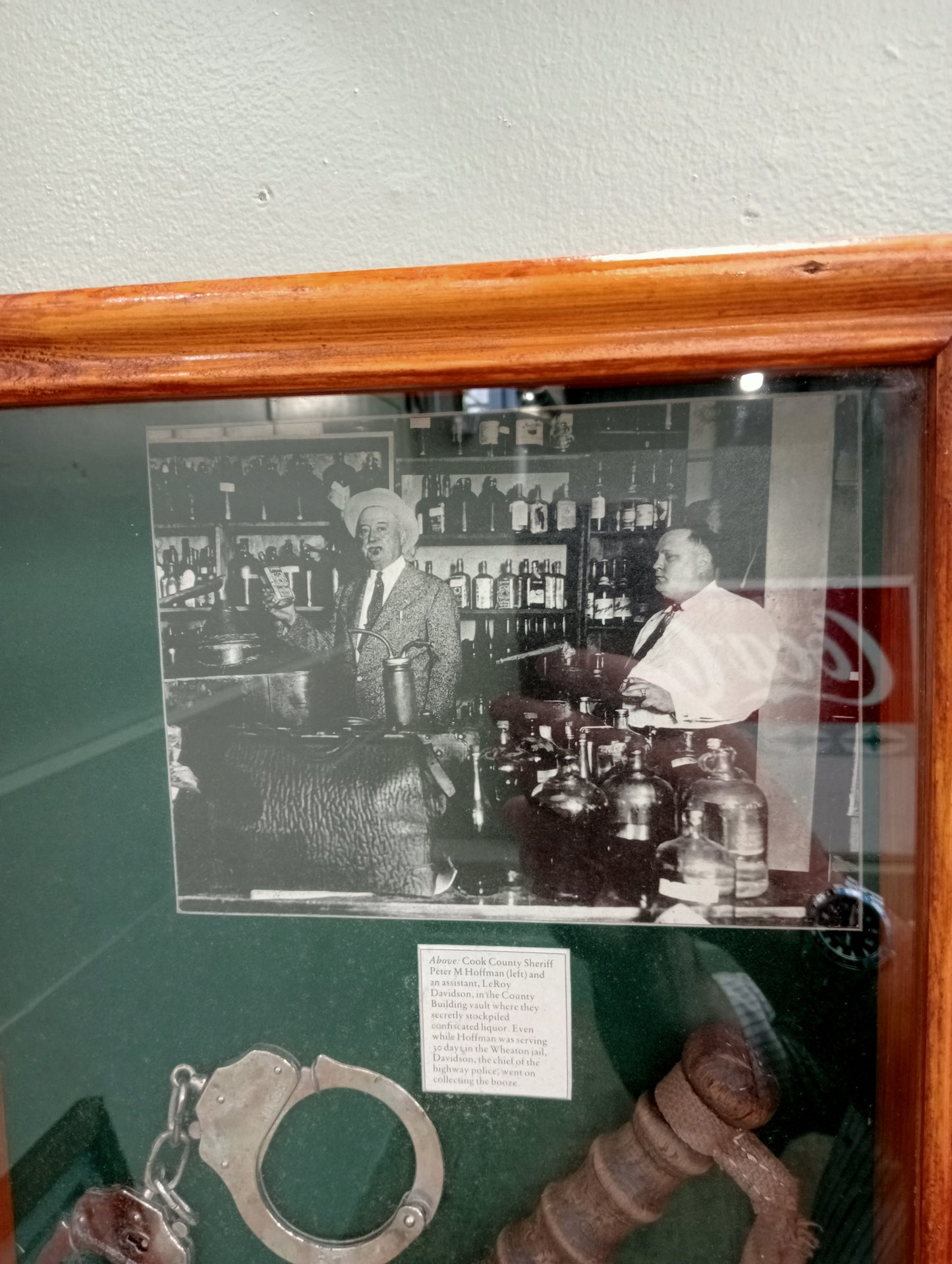 Prohabition glazed showcase 1924 showing confession of prohibited beer and wine in Chicago