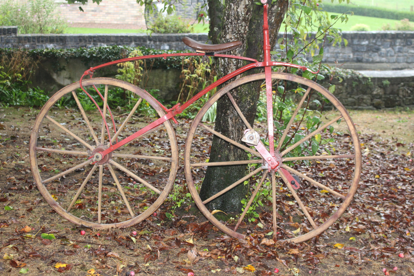 Rare 19th C. Bone shaker bicycle with wooden wheels and leather saddle