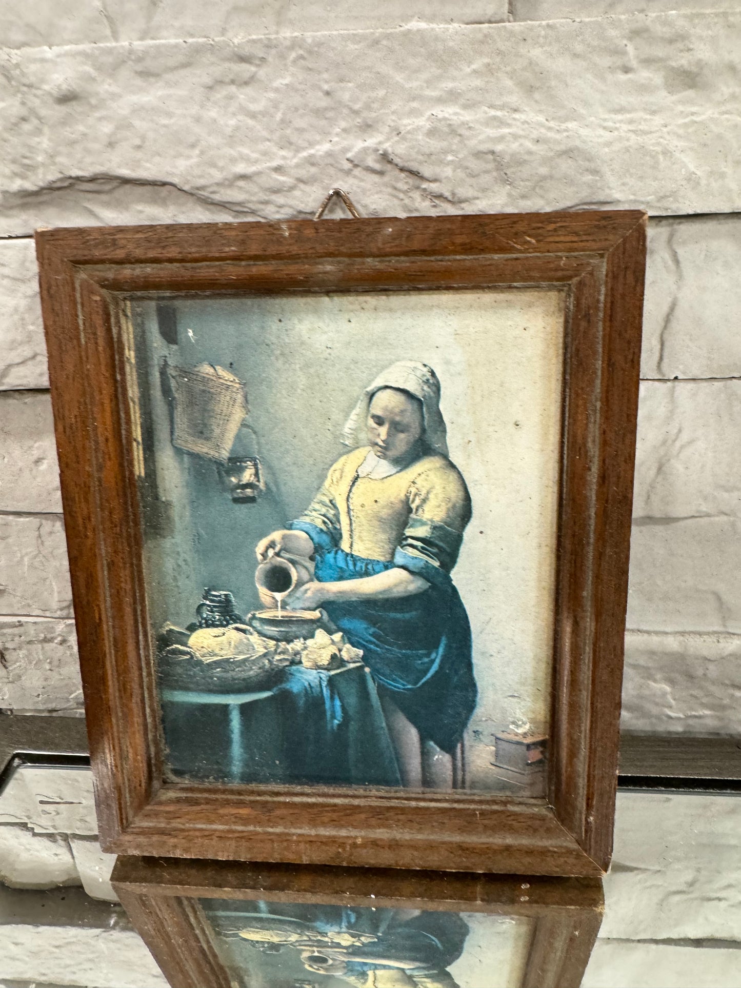 Small wooden frame pouring of milk