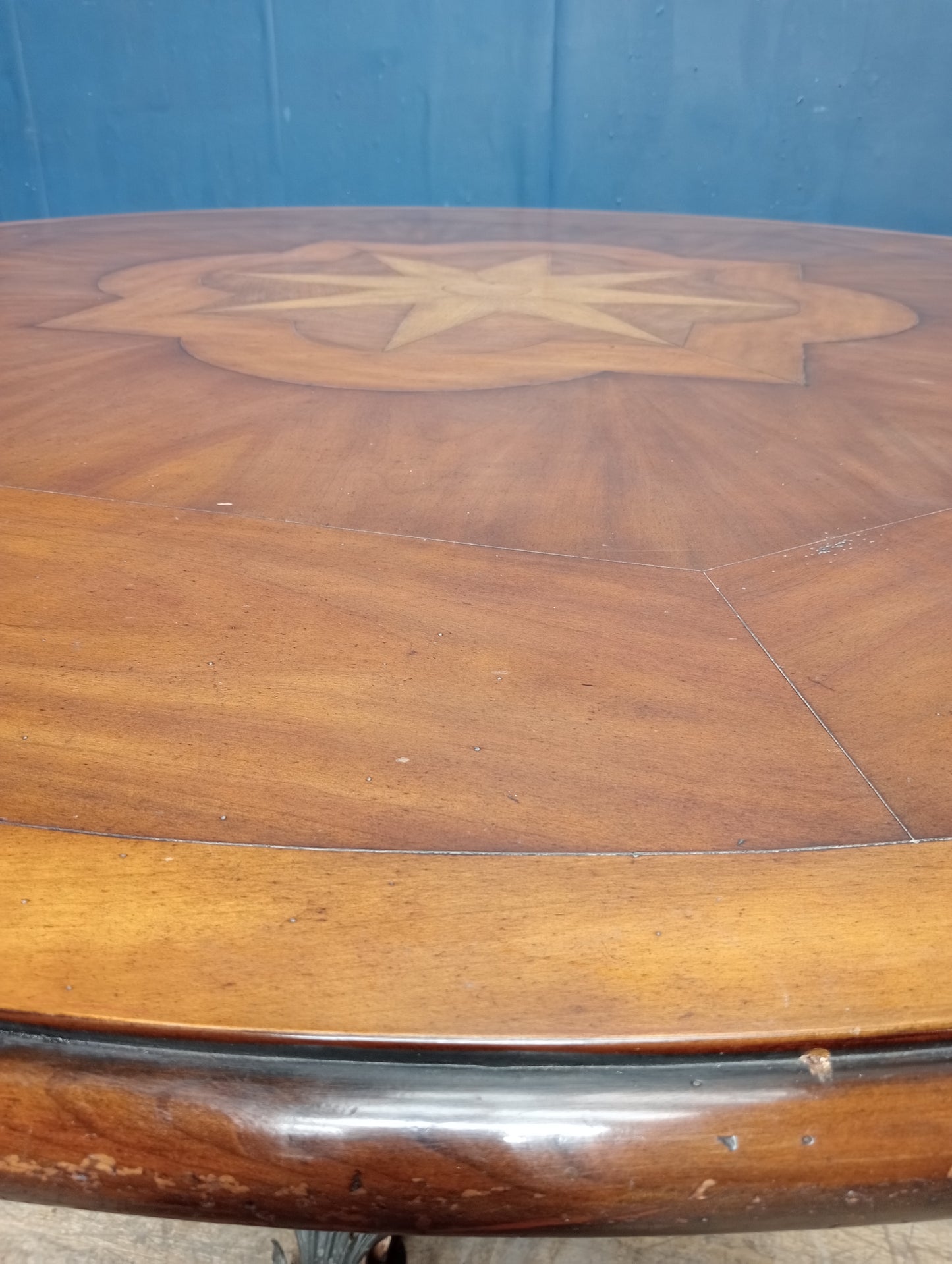 Walnut veneered table with scrolled wrought iron base anthius leaf design