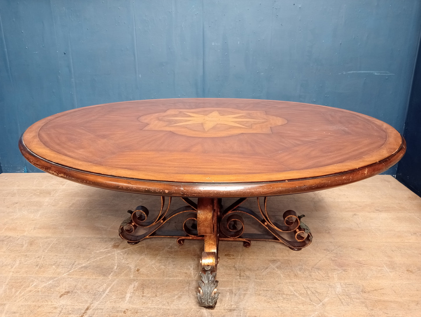Walnut veneered table with scrolled wrought iron base anthius leaf design