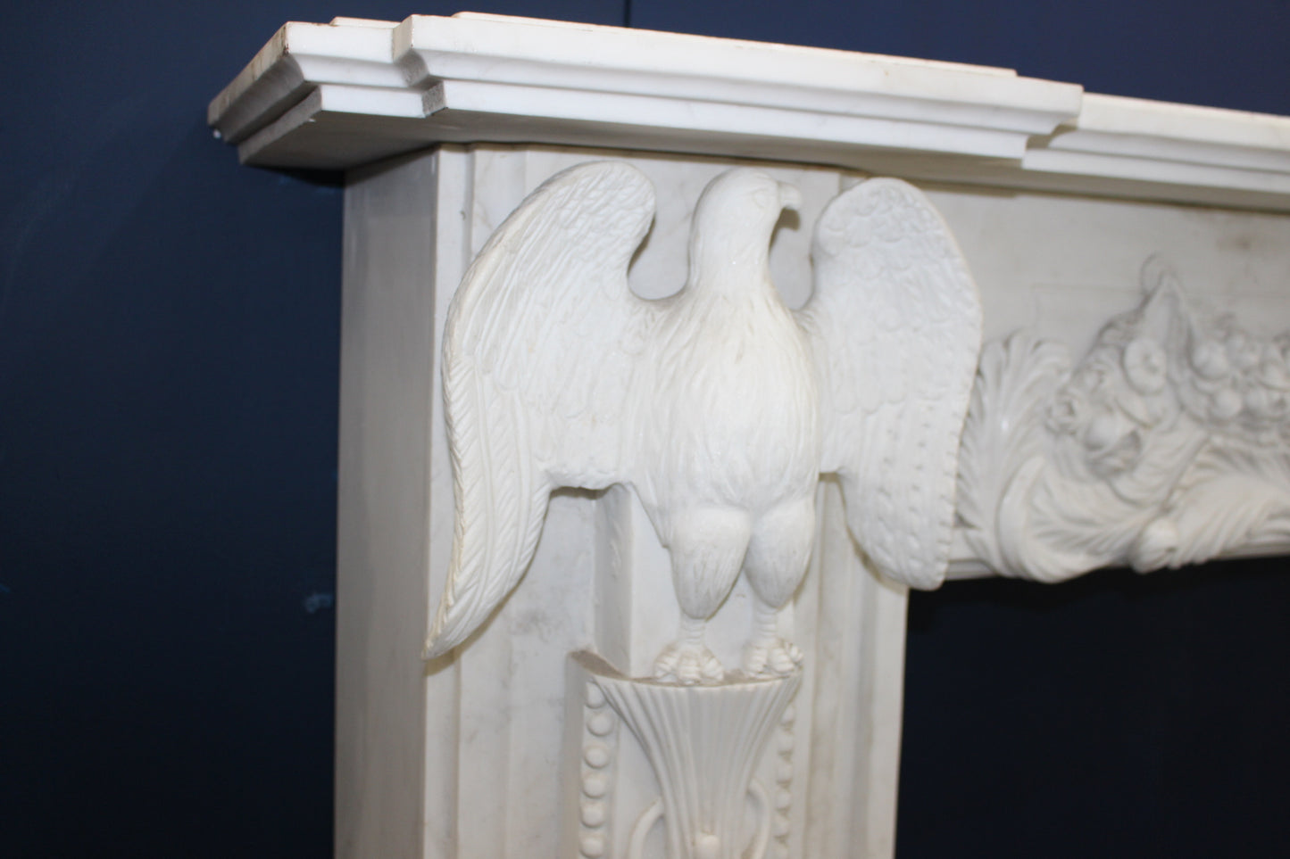 White marble fireplace with handcarved eagles