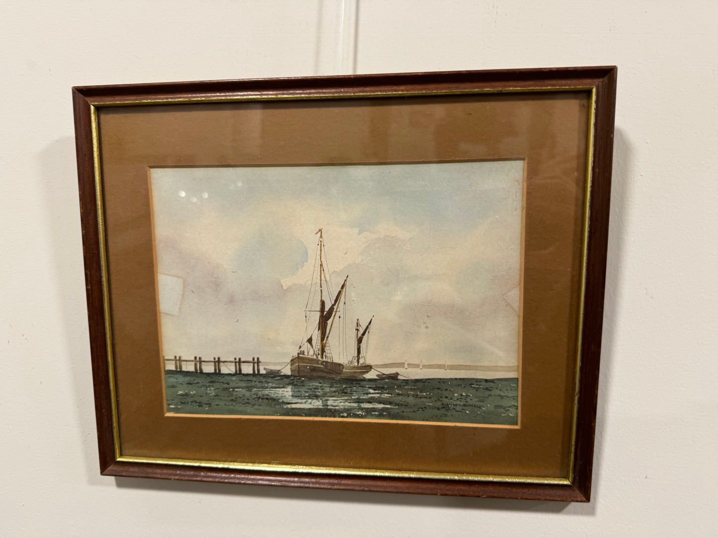 Wooden frame ship leaving dock