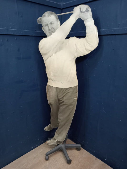 Wooden golfer on stand