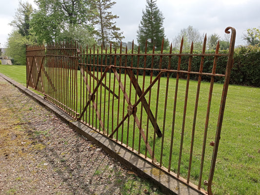 8.56 metres of blacksmith forged double sided railings with central crest