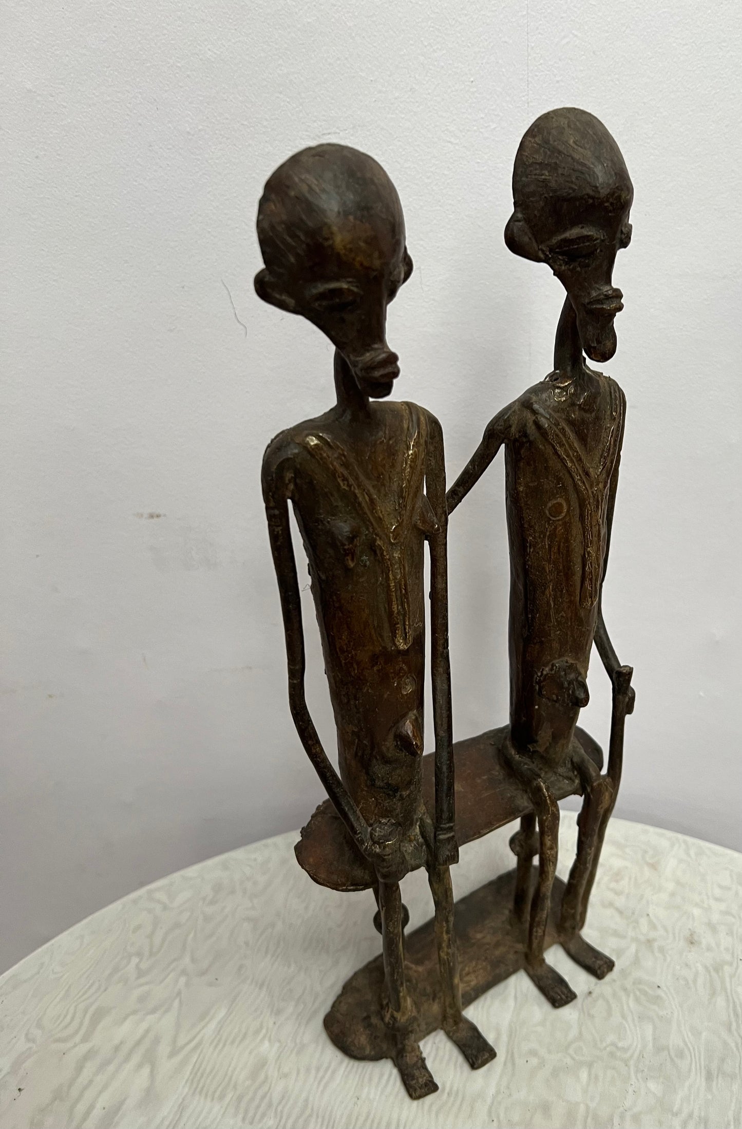 African Bronze statue of couple on bench