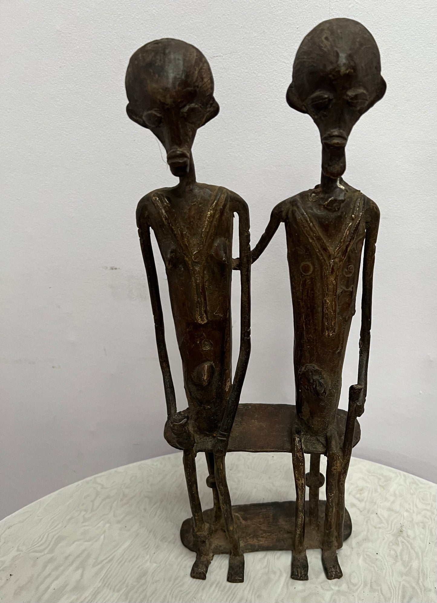 African Bronze statue of couple on bench