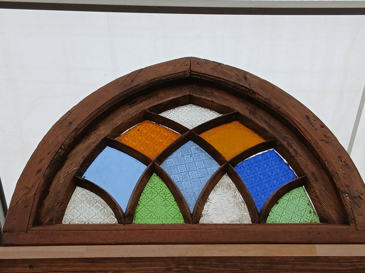 Arched stained glass fanlight window