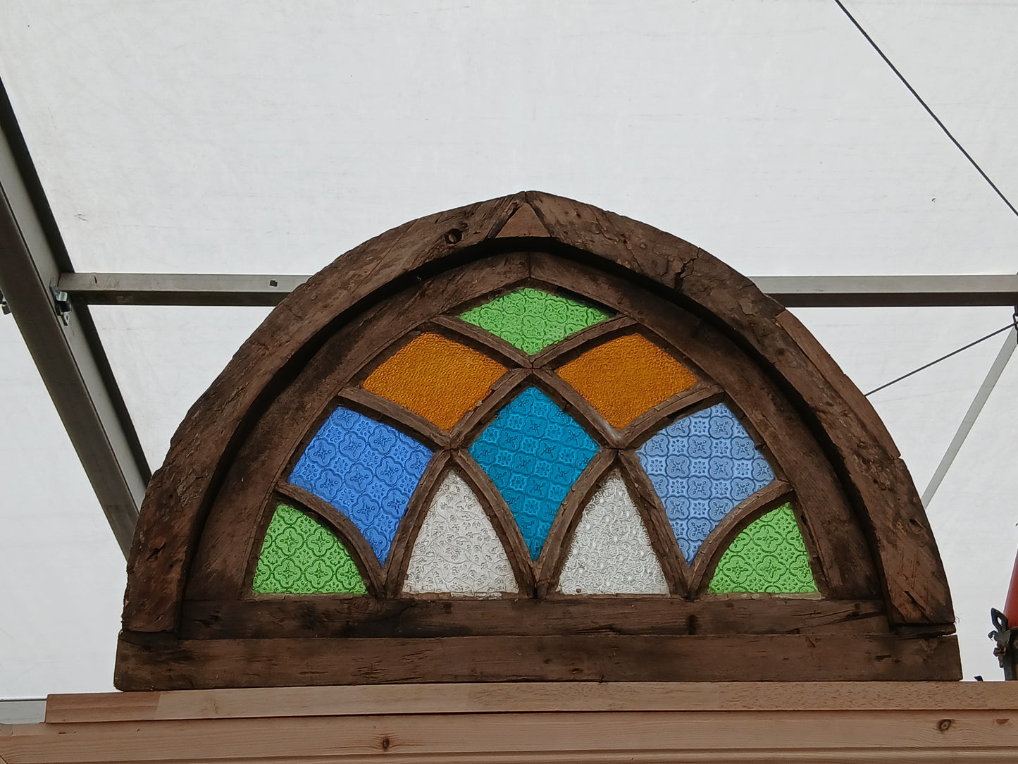 Arched stained glass fanlight window